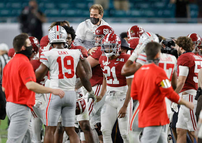 Alabama center Landon Dickerson lifts Nick Saban following the Tide's win